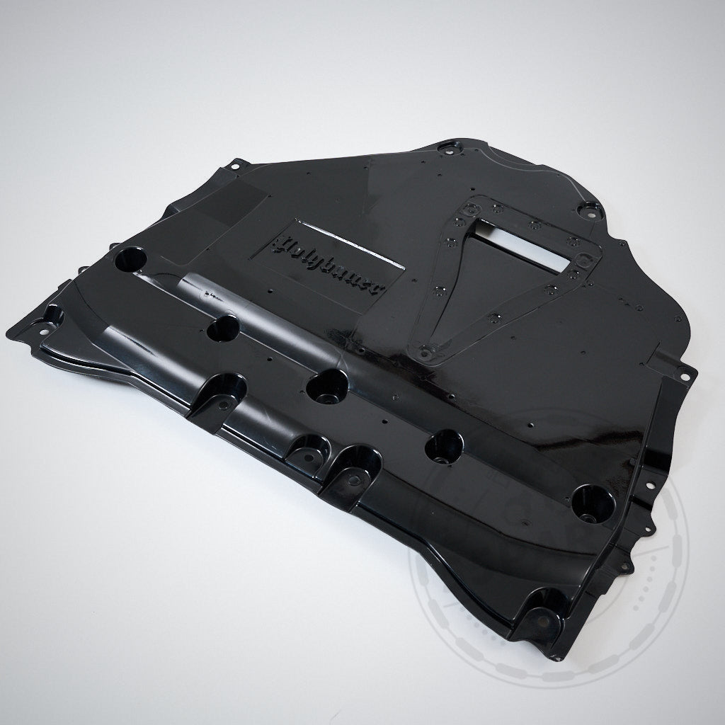 Schwarzer GFK-Unterboden inkl. Differential- und Getriebekühlung & Polybauer Automotive, dargestellt auf hellem Hintergrund, passend für Toyota GR Yaris.